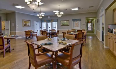 Interior view of a dining room with tables and chairs