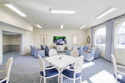 Bright common area with seating and television