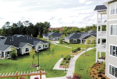 Aerial view of Colonial Gardens with pathways and greenery
