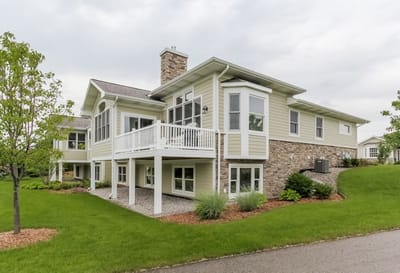 Exterior view of Cook Valley Estates facility with landscaped yard