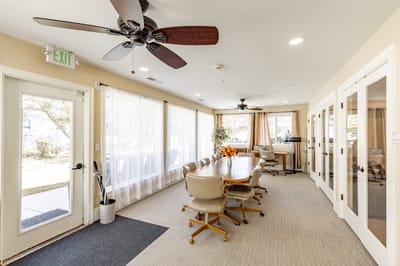 Bright and spacious common area with a dining setup