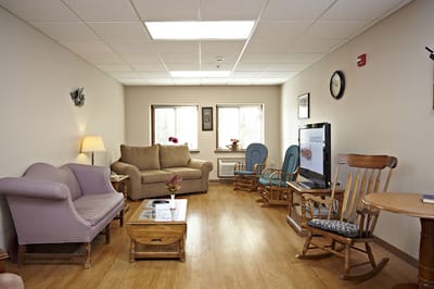 Comfortable common area with seating and a television
