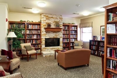 Cozy common area with bookshelves and seating
