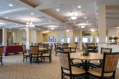 Dining area with tables and chairs in a well-lit room