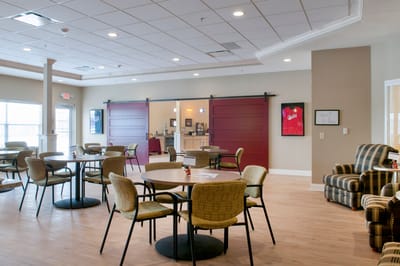 Interior view of a common area with seating and tables