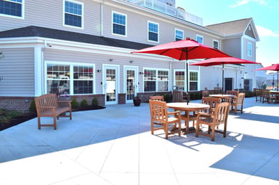 Outdoor seating area with tables and umbrellas