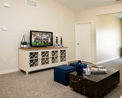 Cozy lounge area with a TV and snacks on the table
