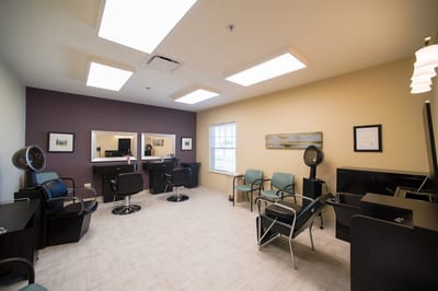 Interior view of a salon with styling chairs and mirrors