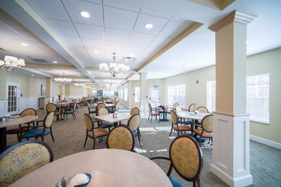 Bright dining room with tables and chairs