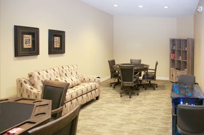 Bright common area with seating and tables