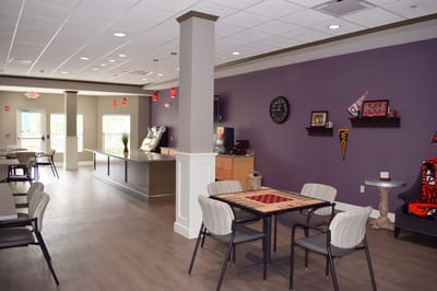 Bright common area with tables and chairs