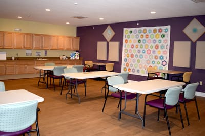 Bright common area with tables and chairs