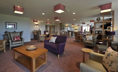 Common area with comfortable seating and lighting