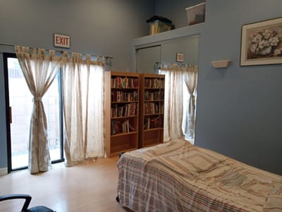 Cozy interior of a resident room with a bookshelf