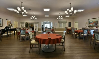 Bright dining room with tables set for meals