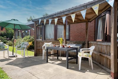 Outdoor seating area with a table and chairs