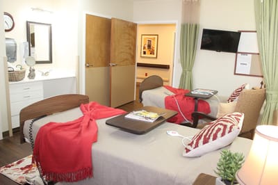 Bright, well-furnished resident room with two beds