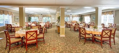 Bright dining room with tables set for meals