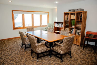 Bright common area with seating and bookshelves