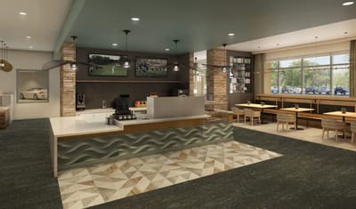 Interior view of a dining area with tables and a snack bar