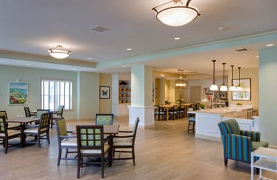 Bright common area with seating and dining tables