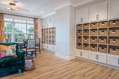 Bright common area with seating and storage.