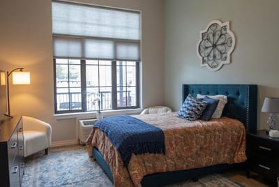Cozy resident room with bed and decor