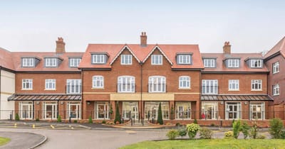 Exterior view of Elmbridge Village showcasing the building.