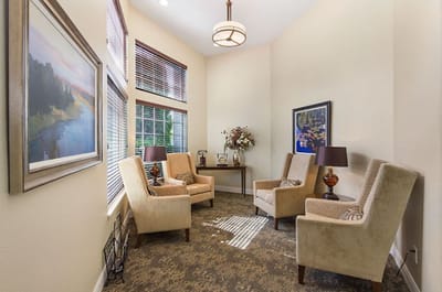 Cozy common area with comfortable seating and artwork