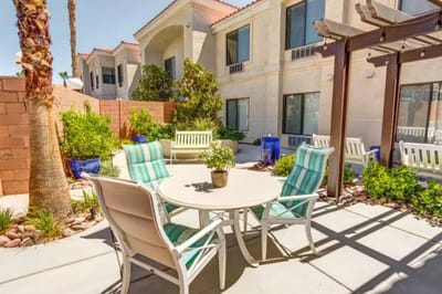 Outdoor seating area with plants and shade