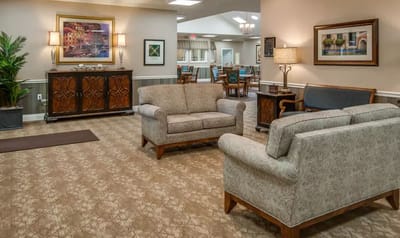 Common area with comfortable seating in a senior living facility