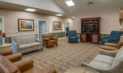 Cozy common area with comfortable seating and artwork