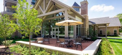 Outdoor seating area with tables and umbrellas