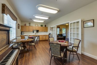 Common area with tables and a piano