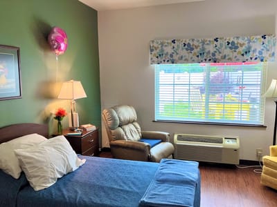 Cozy private room with a bed and seating area