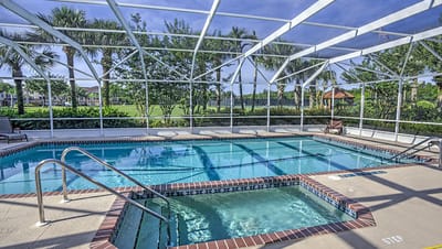 Indoor swimming pool area with lounge chairs