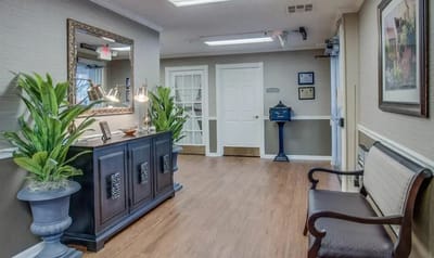 Bright interior hallway with plants and decorative elements