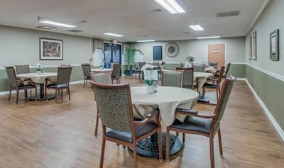 Bright dining room with tables set for meals