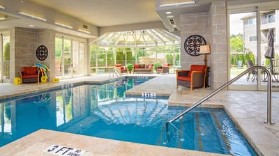 Indoor swimming pool area with natural light