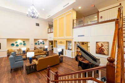 Interior common area with seating and a piano