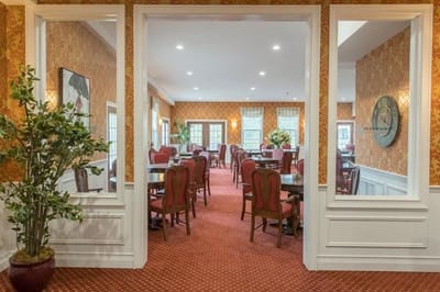 A view of the dining room with tables set for residents