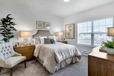 Cozy resident room with a bed and personal decor