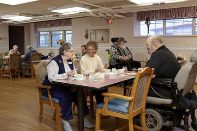 Residents enjoying lunch in a dining room