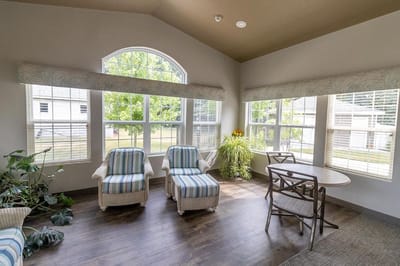 Bright common area with comfortable seating by windows
