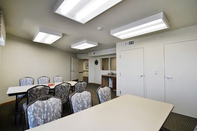 Bright activity room with tables and chairs