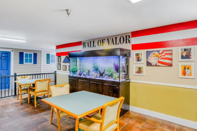 Interior common area with fish tank and decorated wall