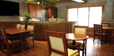 Common area with wooden tables and chairs