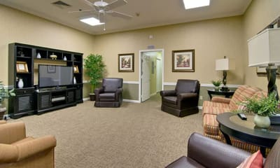 Cozy common area with seating and a TV