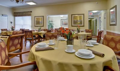 Dining area set with dishes and flowers