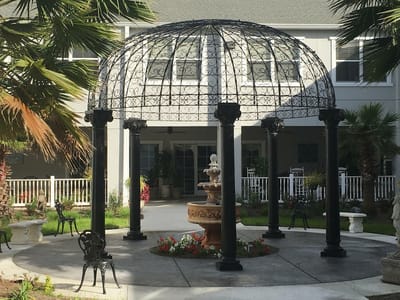 Garden gazebo surrounded by tropical plants